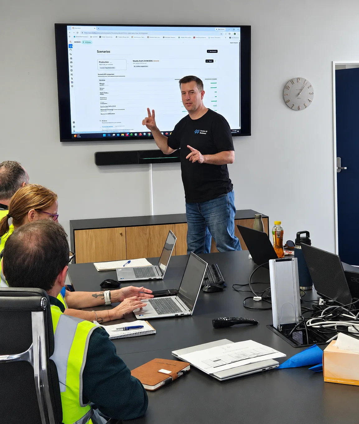 Craig Bennett presenting planning software to a manufacturing team in a workshop